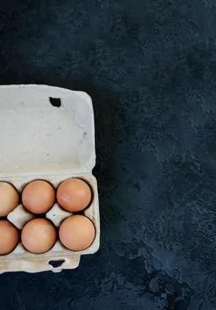 lots of eggs on a dark concrete background