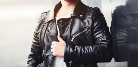 man in urban background wearing leather jacket. street styleの写真素材