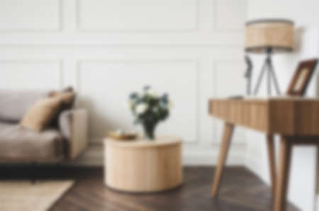 Living room with sofa, armchair, lamp and brick wallの写真素材
