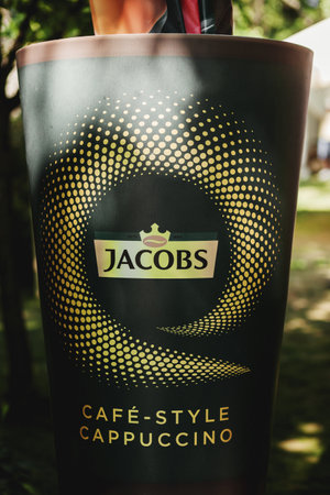 Minsk, Belarus, March 2022 - Jacobs coffee in a paper cup.のeditorial素材