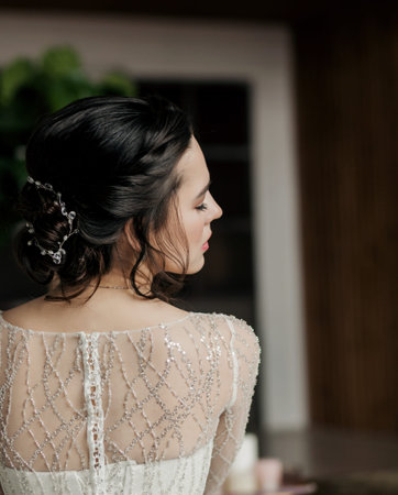 Bride in wedding dress near wall. elegant beautiful woman in fashion styleの写真素材