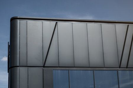 Modern brick building with dramatic sky background. new apartment. old architectureの写真素材