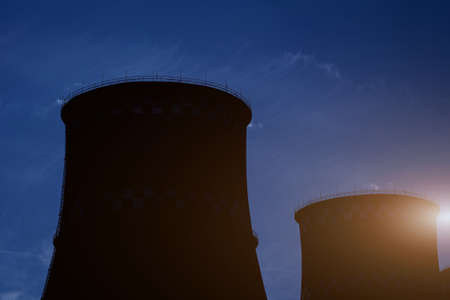 silhouette industrial pipes of thermal power plant. climate changeの写真素材