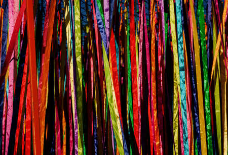satin colorful ribbons as background. bright texture of multicolored ribbonsの写真素材