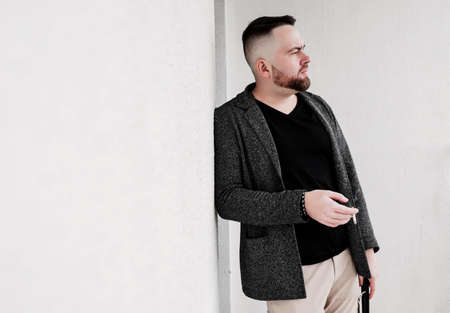 photo of bearded guy smoking cigarette. bad habitsの写真素材