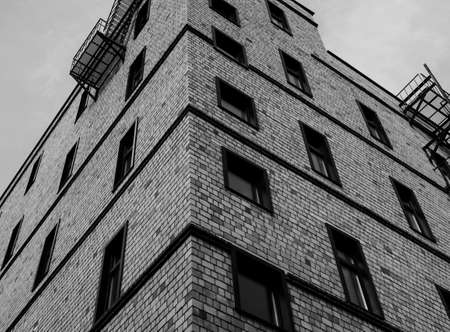 City housing of dark brick exterior in a modern style of architectureの写真素材