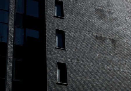 City housing of dark brick exterior in a modern style of architectureの写真素材