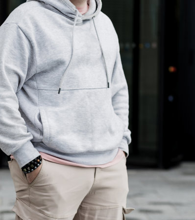 handsome hipster man in sunglasses with beard wearing gray blank hoodie or sweatshirtの写真素材
