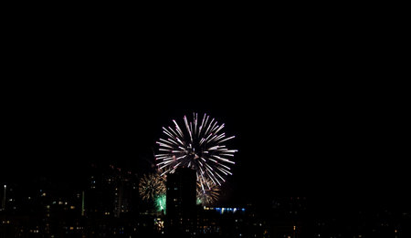 pyrotechnic show over the city. bright fireworks for Christmasの写真素材