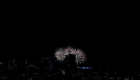 pyrotechnic show over the city. bright fireworks for Christmasの写真素材