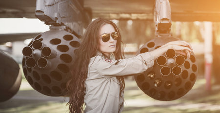 fashion model in military uniform and aviator sunglassesの写真素材