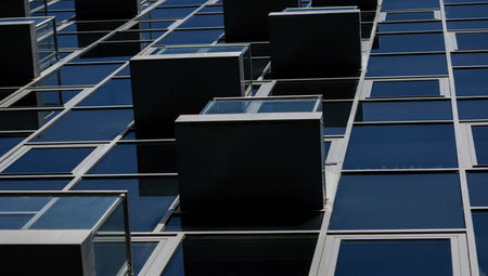 Abstract fragment of modern architecture, walls made of glass and concrete.の写真素材