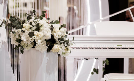 white artificial flowers near the piano. wedding decorの写真素材