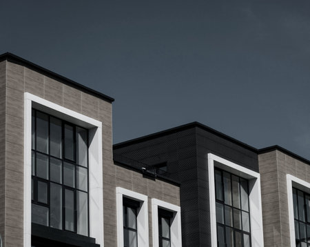 new apartment building over sky. Modern multistoried modern, new and stylish living block of flats.
