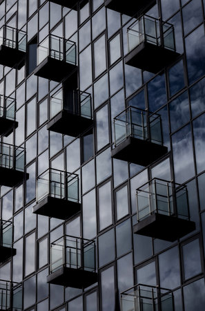 facade of a glass hotel building with balconies around the perimeterのeditorial素材