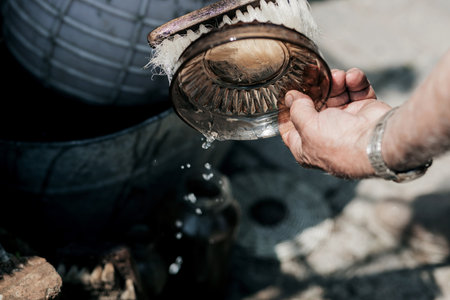 close-up of hands washing a glass bowl.の写真素材