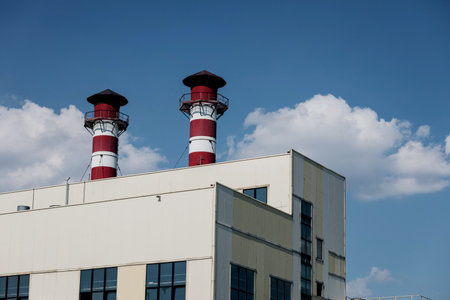 industrial warehouse or production building with large pipes. exterior of factoryの写真素材