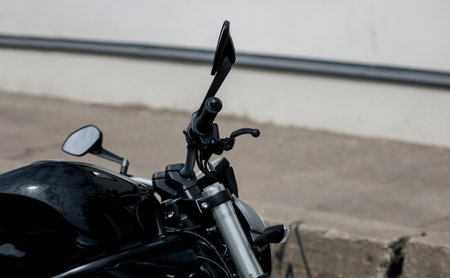 motorcycle rearview mirror. close-up of the steering wheel of the bikeの写真素材