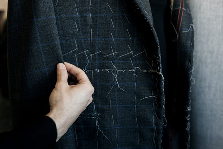 atelier for tailoring. professional tailor workingの写真素材