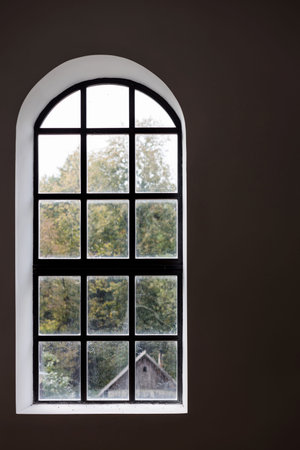 Dark interior with large rustic window. old fashioned vintage house