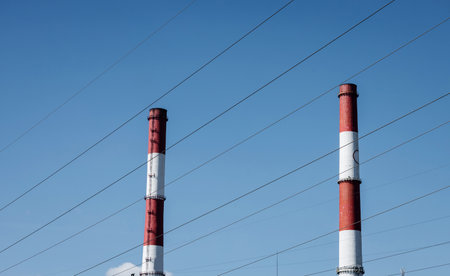 Pipes of electric power plant over sky. environmental pollutionの写真素材