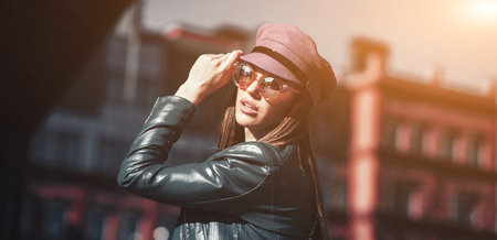 Outdoor beauty portrait woman, fashion model, pretty girl, street style, sunglasses, leather, casual.の写真素材