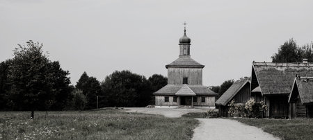 Old wooden church with cross in the countryside.の写真素材