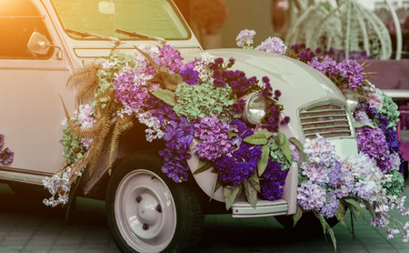 retro car with flowers in the city. vintage carの写真素材