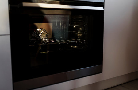 modern oven built in kitchen furniture. house hold equipment. front view.の写真素材