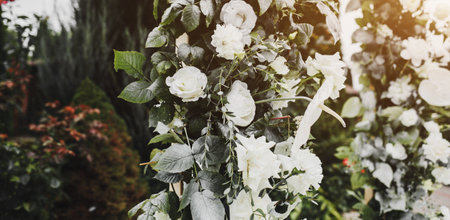 wedding arch made of fresh flowers. close-up of floral decorの写真素材