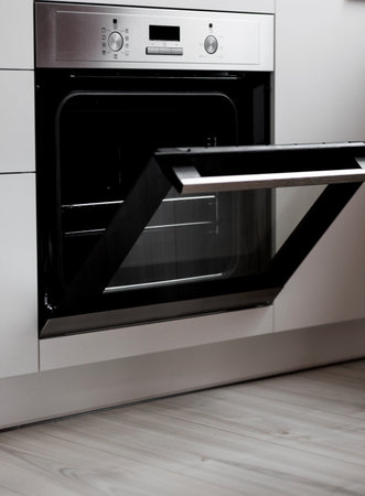 New open electric oven in kitchen. built-in household appliancesの写真素材