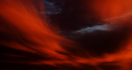 Beautiful dark orange sky with clouds. Dramatic sunset