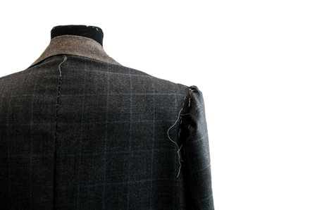 Details of a tailored back suit jacket isolated on white background with markings on it for stitchingの写真素材