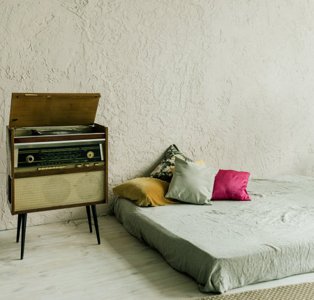 Cozy room with a bed on the floor. loft interior.の写真素材