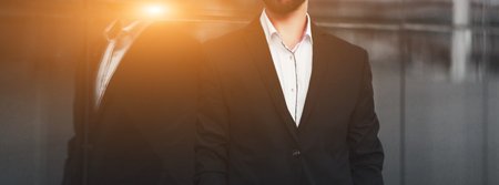 elegant fashion man in urban setting. businessman in suitの写真素材
