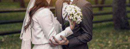 wedding romantic couple. portrait of bride and groom outdoor. Young and beautiful couple in love huggingの写真素材