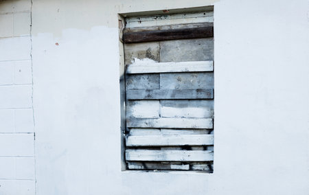 Boarded up window in the old house. old abandoned building. exclusion zoneの写真素材