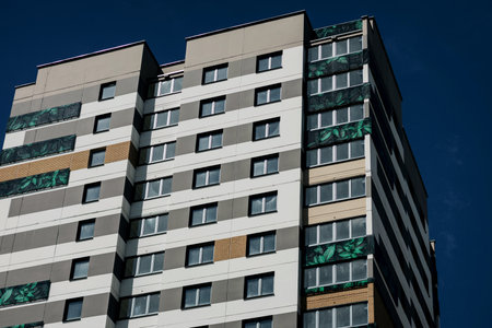 Facade of a modern European building over blue sky background. new architectureの写真素材