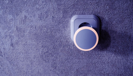 light from the bulb and shadow plugs in the wall. copy spaceの写真素材