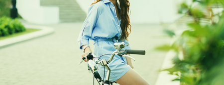 Beautiful woman in hat sitting on bike. urban conceptの写真素材