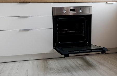 Open modern oven built in kitchen furniture. New electric ovenの写真素材