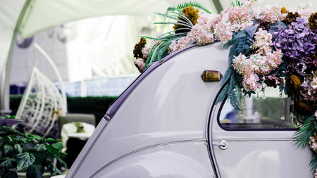 old vintage car decorated with flowers. car with wedding decorationの写真素材