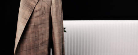 Luxury men's jacket, on mannequin in studio. men's stylish checkered suit. copy spaceの写真素材