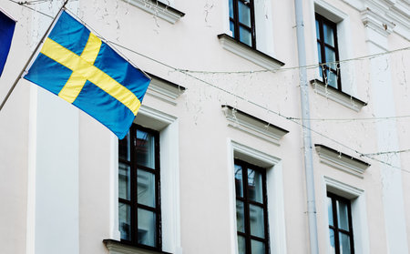 Sweden flag on a street. Embassy of Swedenの写真素材