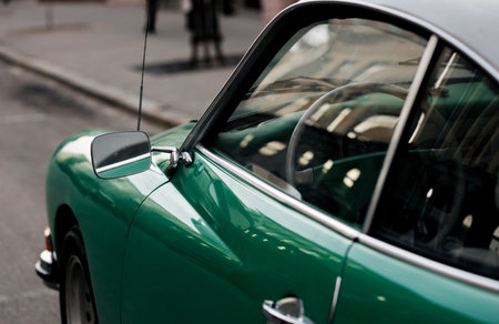 Side view of a classic green car. vintage car mirrorの写真素材