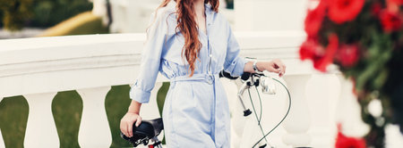 Stylish woman on a bicycle in summer park. lifestyle conceptの写真素材