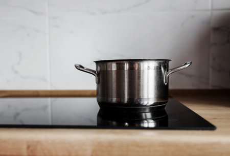 ceramic induction stove with pot, pan on clean surface. modern apartment with modern interior,の写真素材