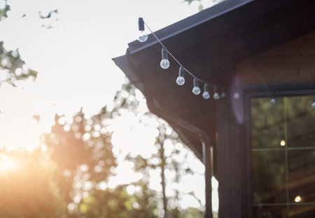 hanging light bulbs outdoors. string lightsの写真素材