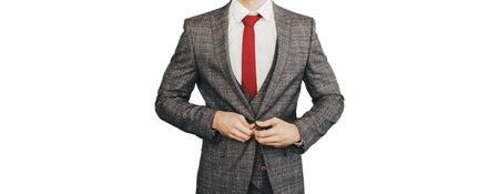 Groom fixing his jacket. groom dressed in formal suit isolated on white background. Elegant groom wedding fashion.の写真素材