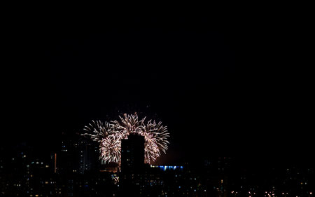 Night landscape with fireworks over the city. celebrationの写真素材